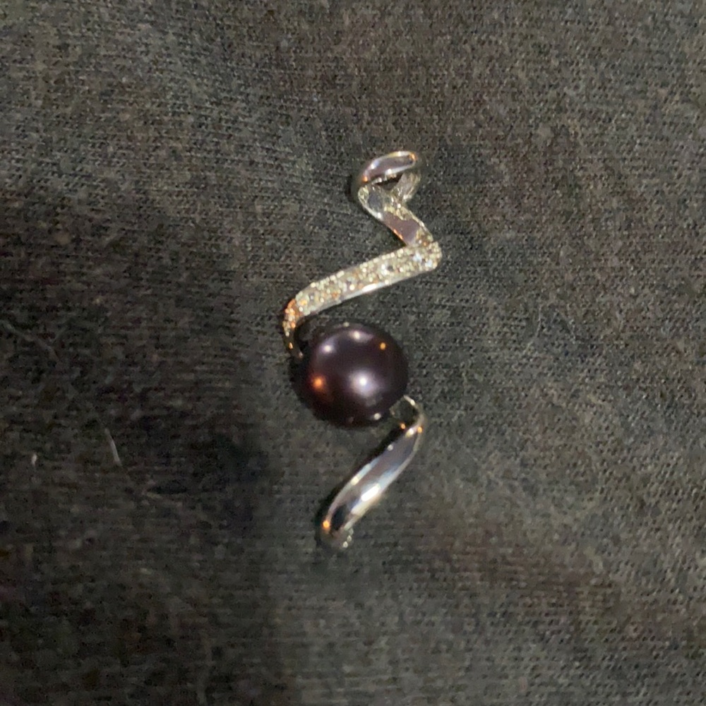 Silver, dark stone, cubic zirconia charm